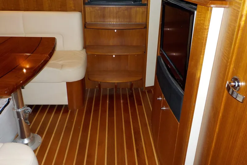 Slide: The Image of Interior of 2009 Tiara Yachts 3900 Open with wood flooring and seating area. - 27