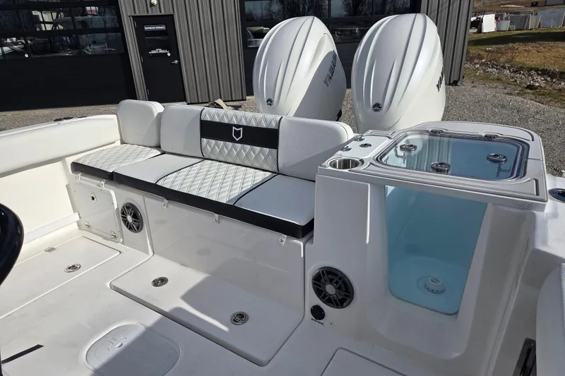 Slide: The Image of 2026 Sea Fox 268 Commander boat interior with seating and dual Yamaha engines. - 13