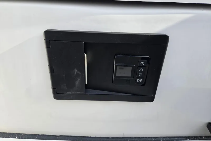 Slide: The Image of Control panel on 2026 Sea Fox 268 Commander boat, featuring digital display and buttons. - 17