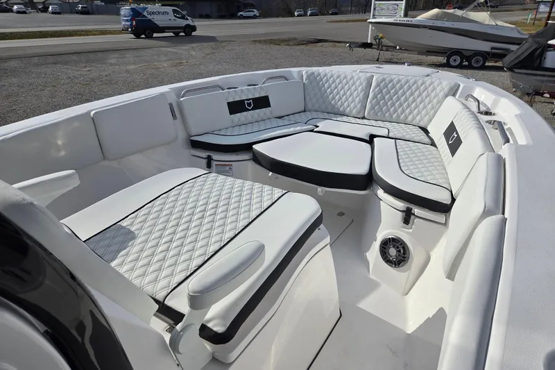 Slide: The Image of 2026 Sea Fox 268 Commander boat interior with luxurious white seating and quilted design. - 6