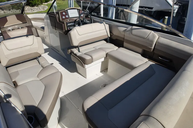 Slide: The Image of 2014 Formula 240 Bowrider interior with beige seating and modern dashboard. - 28