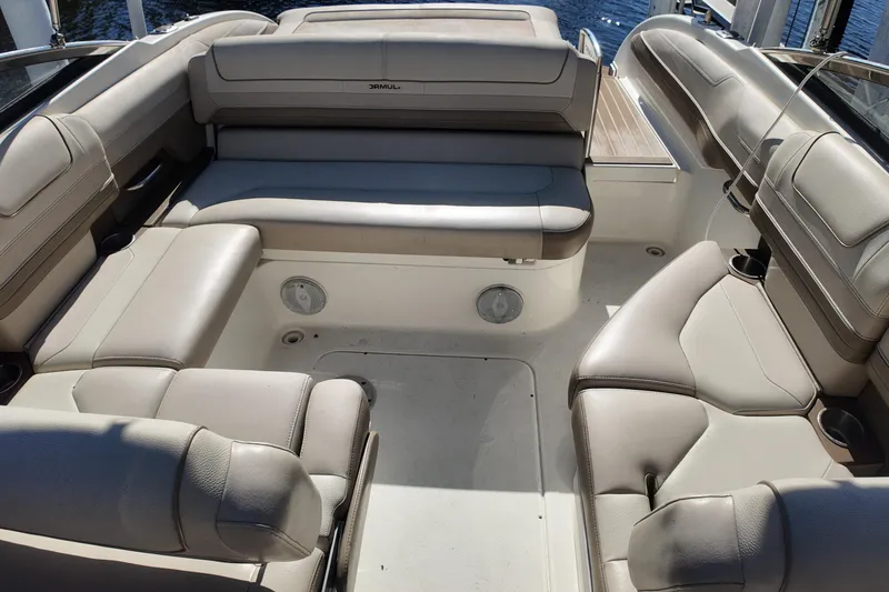 Slide: The Image of 2014 Formula 240 Bowrider interior with beige leather seating and spacious layout. - 30