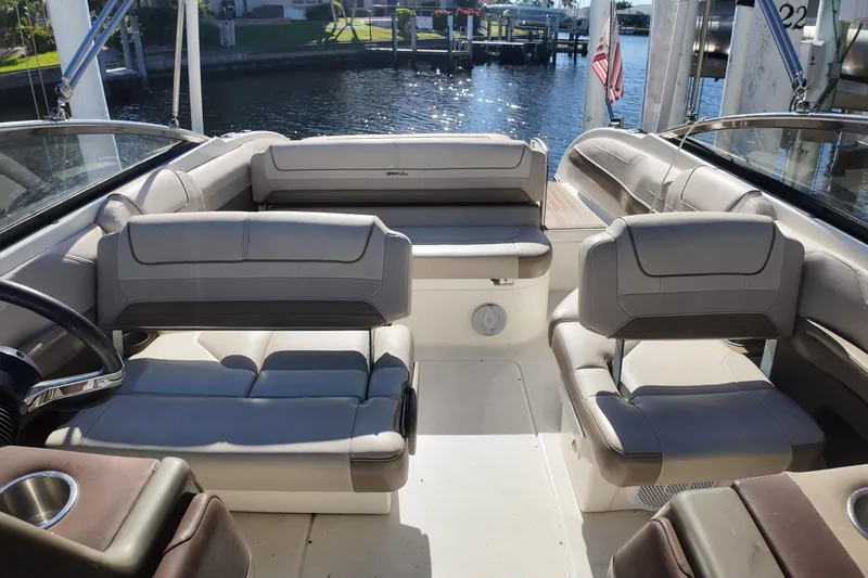 Slide: The Image of 2014 Formula 240 Bowrider interior with plush seating and waterfront view. - 31