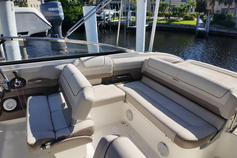 Slide: The Image of 2014 Formula 240 Bowrider interior with beige seating and Yamaha engine in background. - 33
