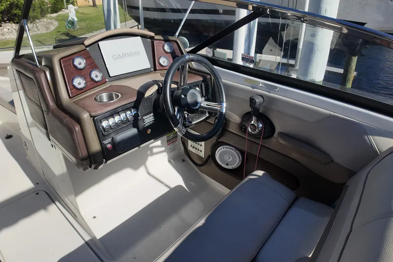 Slide: The Image of 2014 Formula 240 Bowrider dashboard with Garmin navigation system and steering wheel. - 34