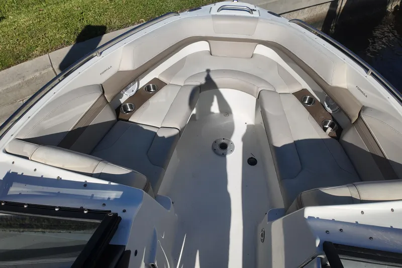 Slide: The Image of 2014 Formula 240 Bowrider boat interior with spacious seating and cup holders. - 37