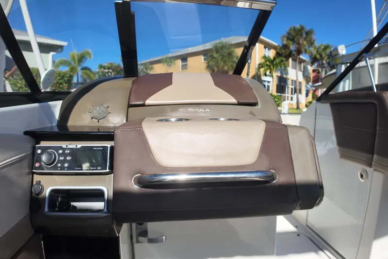Slide: The Image of 2014 Formula 240 Bowrider dashboard with control panel and steering wheel. - 39