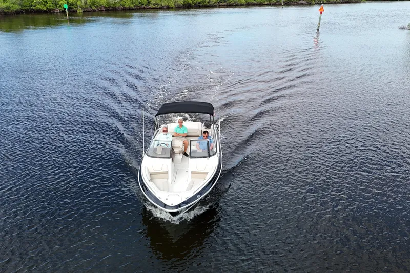 Slide: The Image of 2014 Formula 240 Bowrider cruising on a calm lake with passengers onboard. - 49