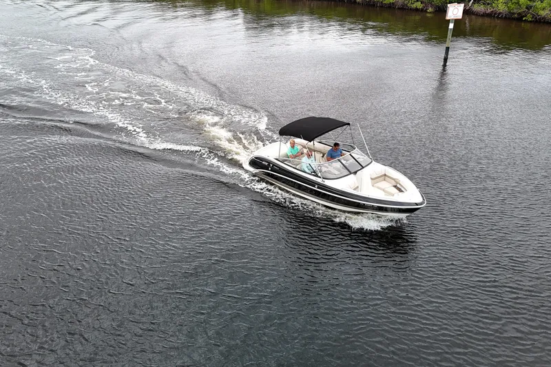 Slide: The Image of 2014 Formula 240 Bowrider cruising on a calm river with passengers onboard. - 54