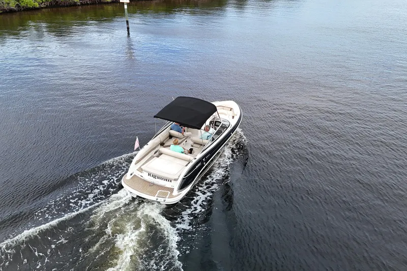 Slide: The Image of 2014 Formula 240 Bowrider cruising on calm water with passengers onboard. - 7