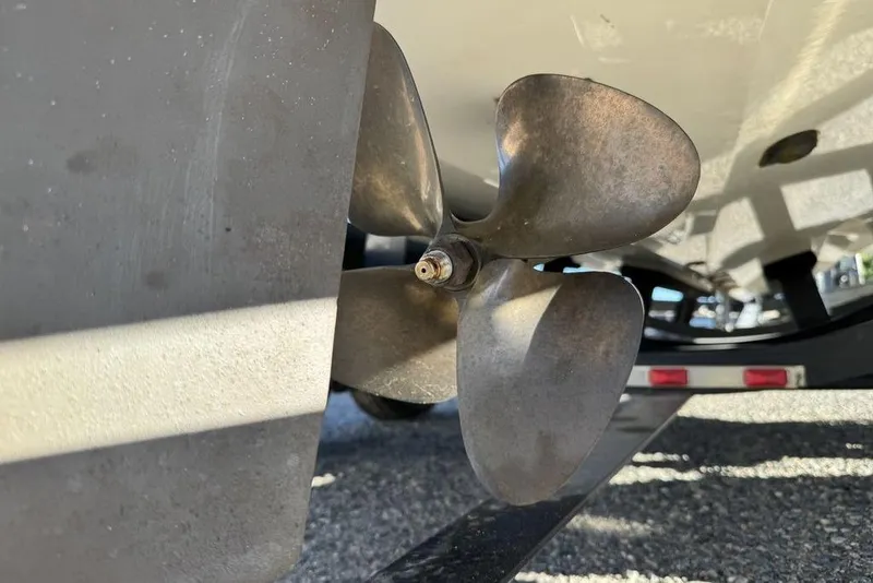 Slide: The Image of Close-up of a 1999 Tigé 2100V Limited boat propeller on a trailer. - 24