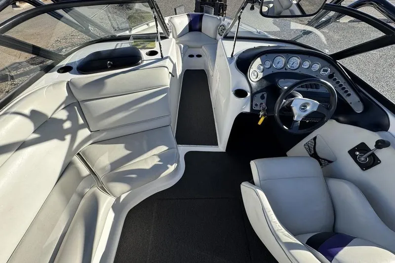 Slide: The Image of 1999 Tigé 2100V Limited boat interior with sleek dashboard and comfortable seating. - 25