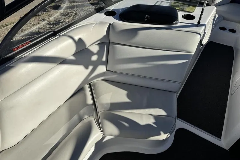 Slide: The Image of 1999 Tigé 2100V Limited boat interior with white leather seating and black accents. - 29