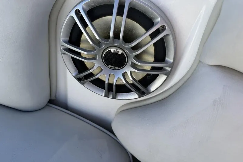 Slide: The Image of Speaker on 1999 Tigé 2100V Limited boat, featuring sleek silver grille design. - 37