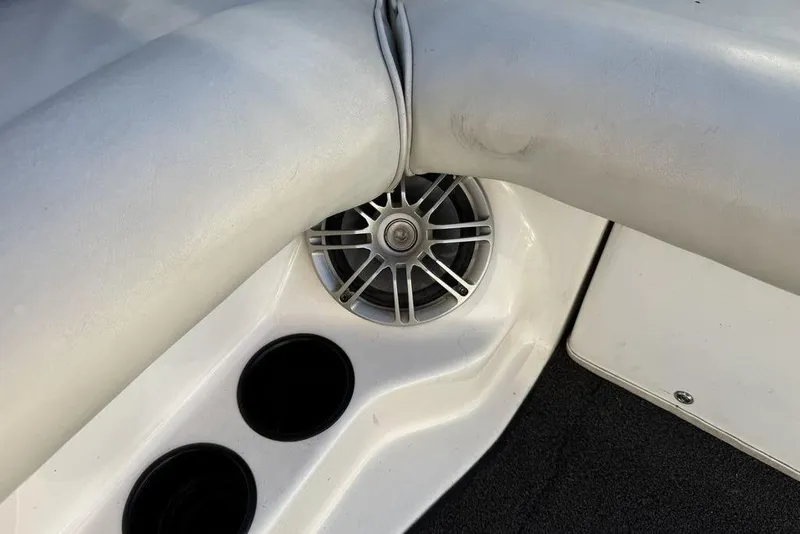 Slide: The Image of 1999 Tigé 2100V Limited boat interior with speaker and cup holders. - 42