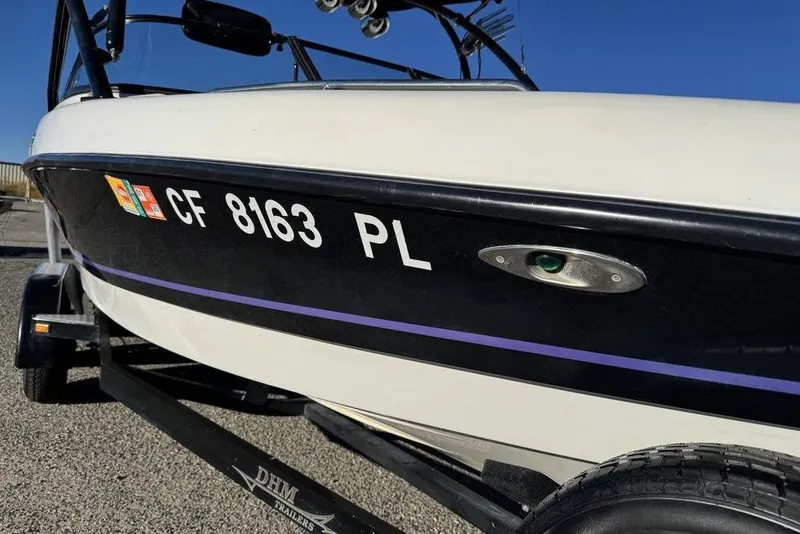 Slide: The Image of 1999 Tigé 2100V Limited boat on trailer, registration CF 8163 PL, sunny day. - 5