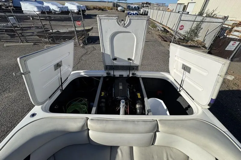 Slide: The Image of 1999 Tigé 2100V Limited boat engine compartment with open hatches. - 53