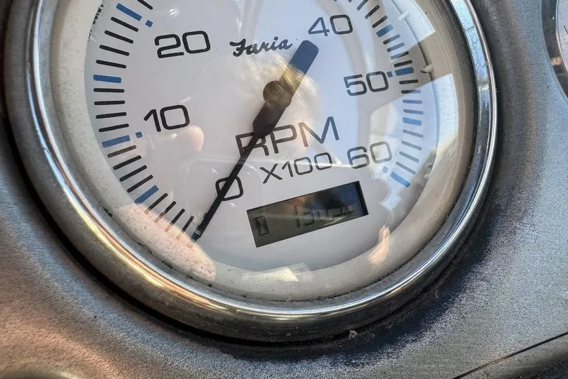 Slide: The Image of Close-up of a 1999 Tigé 2100V Limited RPM gauge displaying 1750 RPM. - 55
