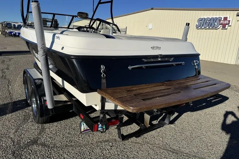 Slide: The Image of 1999 Tigé 2100V Limited boat on trailer, rear view with wooden swim platform. - 57