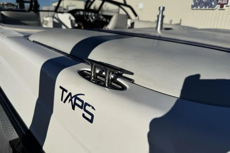 Slide: The Image of 1999 Tigé 2100V Limited boat with TAPS system, close-up view. - 71