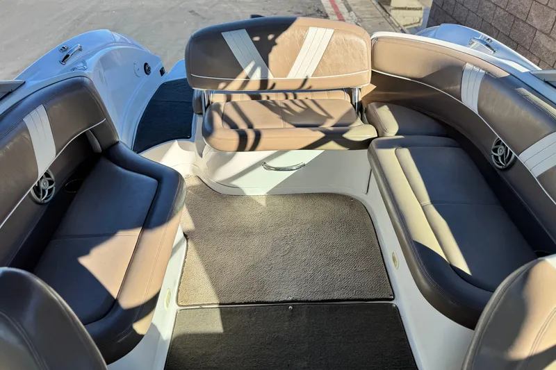Slide: The Image of 2007 Cobalt 252 boat interior with brown leather seating and carpeted floor. - 19