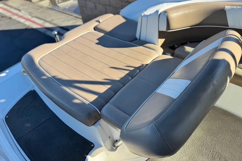 Slide: The Image of 2007 Cobalt 252 boat with tan and white leather seating, showcasing luxury and comfort. - 20