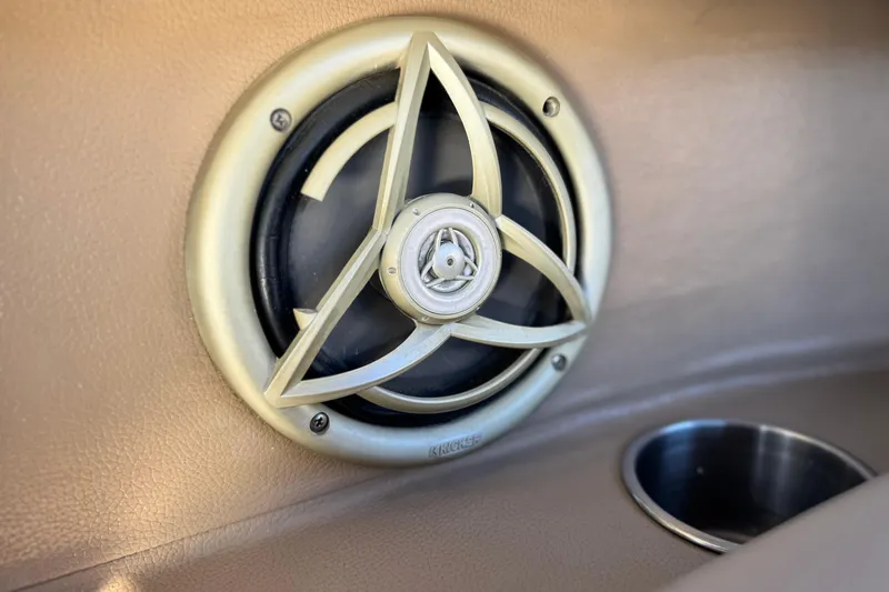 Slide: The Image of Speaker and cup holder in 2007 Cobalt 252 boat interior. - 28