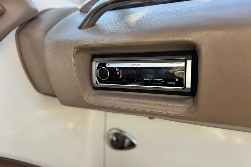 Slide: The Image of Kenwood stereo system in 2007 Cobalt 252 boat dashboard. - 33