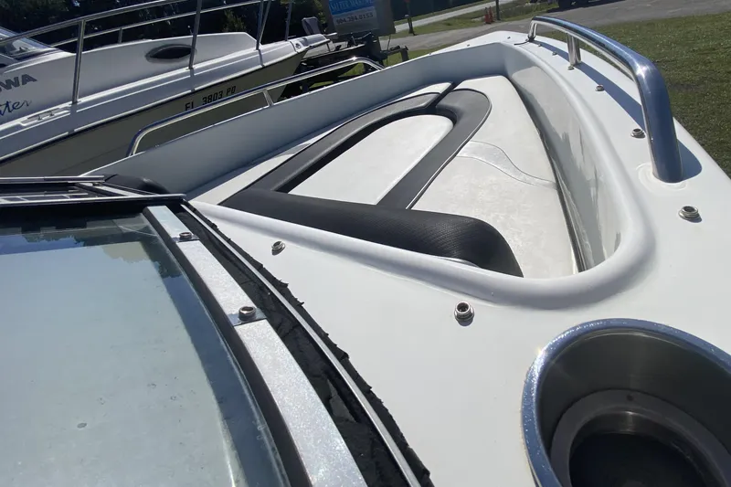 Slide: The Image of 2016 Caravelle 16 EBo boat with sleek white deck and seating area. - 12