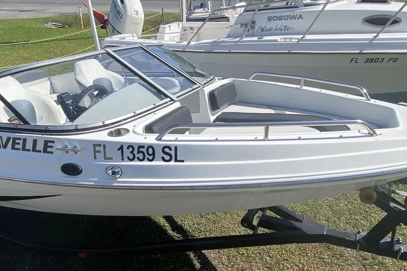 Slide: The Image of 2016 Caravelle 16 EBo boat on trailer, white exterior, registration FL 1359 SL. - 7