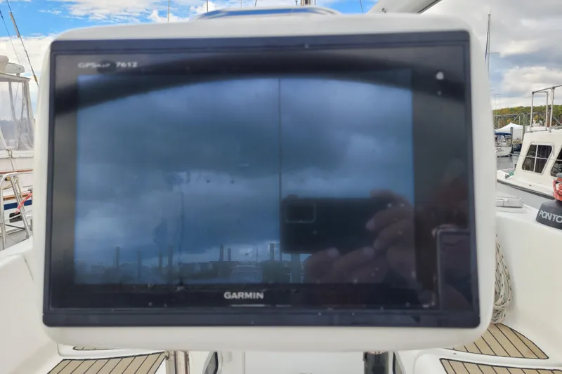 Slide: The Image of Control panel of a 1996 Beneteau First 42s7 sailboat with engine gauges. - 13