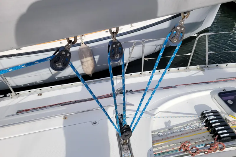 Slide: The Image of Cockpit instruments on a 1996 Beneteau First 42s7 sailboat, featuring navigation displays and winch. - 14