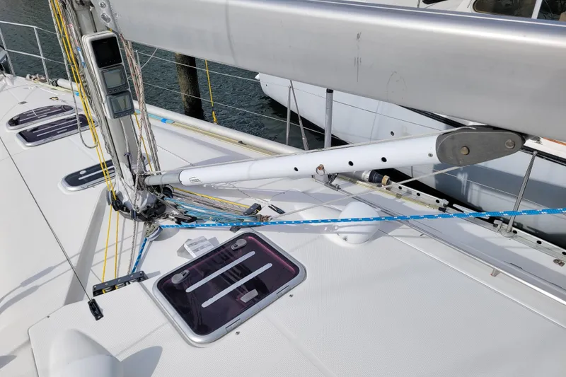 Slide: The Image of Garmin GPS on 1996 Beneteau First 42s7 sailboat, reflecting cloudy sky and marina. - 15