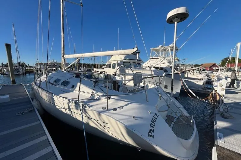Slide: The Image of 1996 Beneteau First 42s7 sailboat docked under clear blue sky. - 4