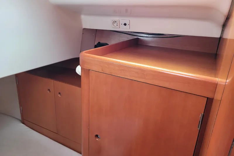 Slide: The Image of Wooden interior detail of a 1996 Beneteau First 42s7 yacht cabin. - 51