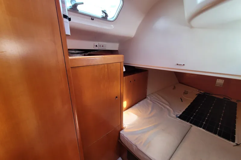 Slide: The Image of Interior of 1996 Beneteau First 42s7 yacht with wooden cabinetry and storage. - 53
