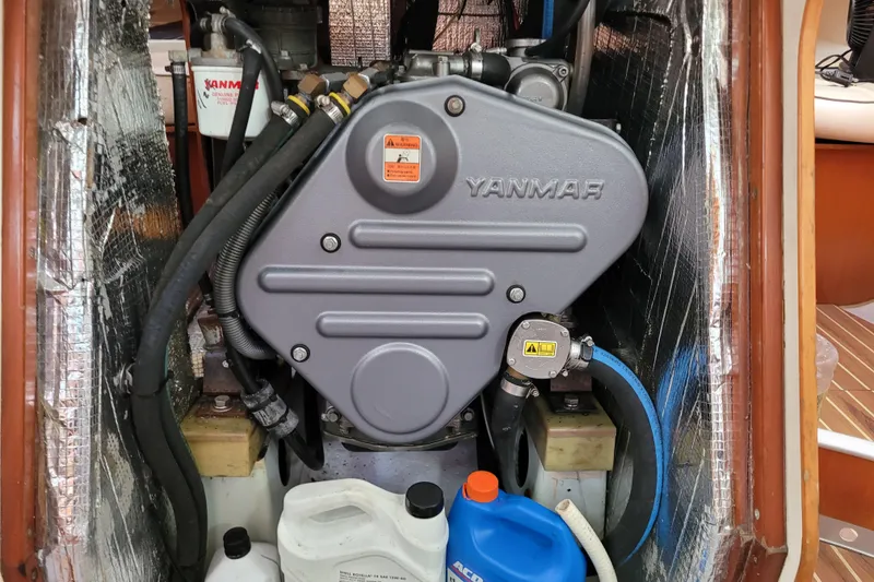 Slide: The Image of Interior cabin of 1996 Beneteau First 42s7 sailboat with wooden cabinetry and cushioned seating. - 55