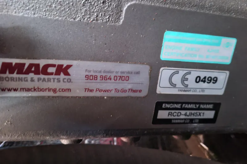 Slide: The Image of Yanmar engine in a 1996 Beneteau First 42s7 sailboat, showcasing alternator and wiring. - 58