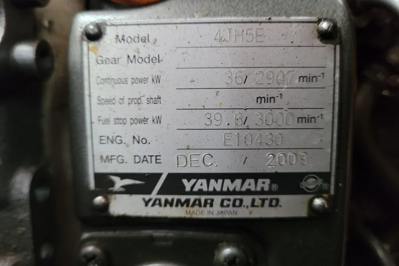 Slide: The Image of Engine compartment of a 1996 Beneteau First 42s7 sailboat, showcasing mechanical components. - 59