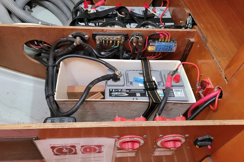 Slide: The Image of Engine compartment of a 1996 Beneteau First 42s7 sailboat, showing fuel tank and hoses. - 64