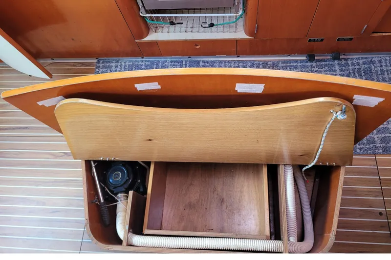 Slide: The Image of Battery compartment of a 1996 Beneteau First 42s7 sailboat with wiring and switches. - 66