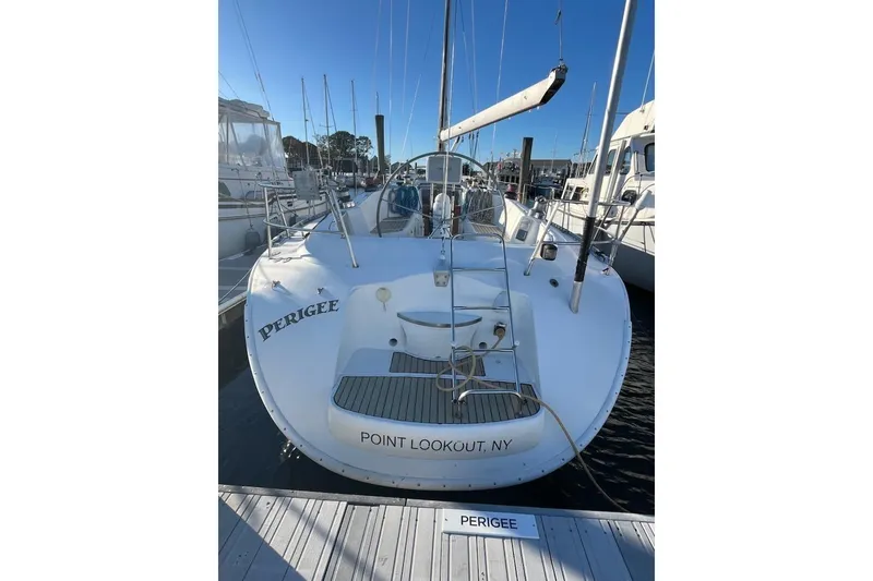 Slide: The Image of 1996 Beneteau First 42s7 sailboat docked at marina, clear blue sky. - 7