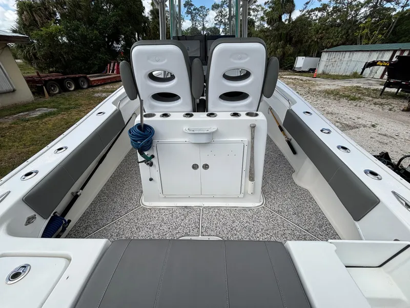 Slide: The Image of 2019 Cape Horn 24 OS boat interior with seating and storage compartments. - 12