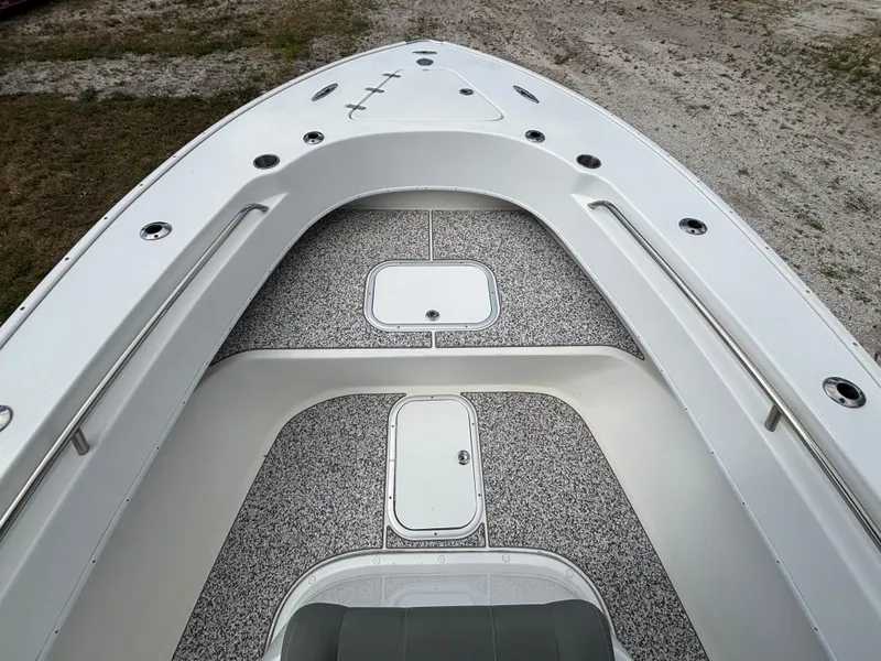 Slide: The Image of 2019 Cape Horn 24 OS boat deck with storage compartments and sleek design. - 17