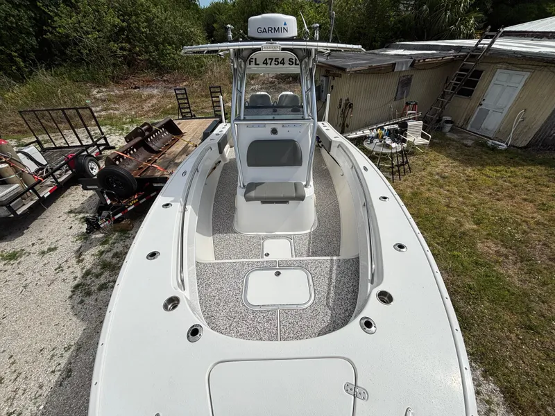 Slide: The Image of 2019 Cape Horn 24 OS boat with Garmin equipment, parked outdoors near a shed. - 19