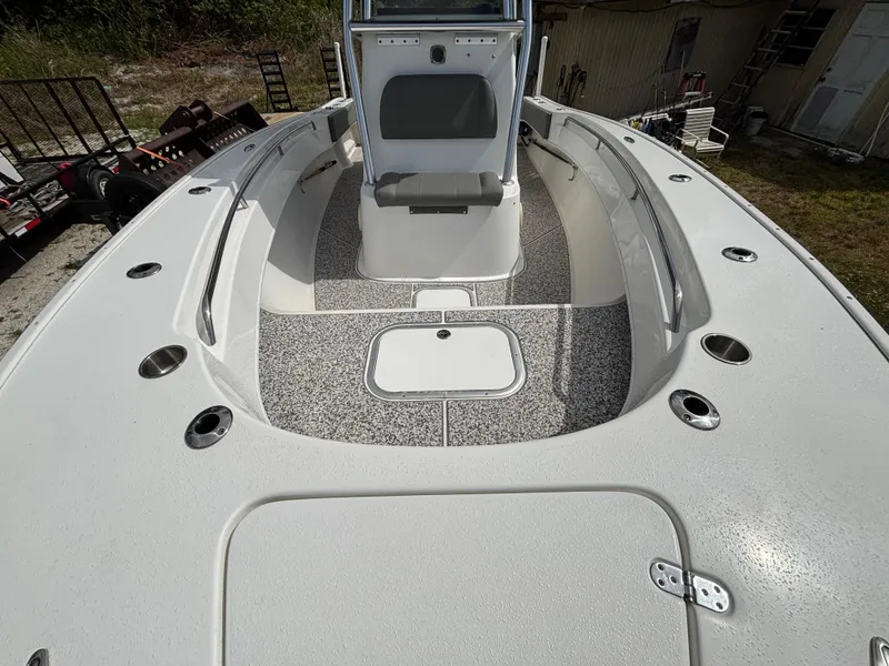 Slide: The Image of 2019 Cape Horn 24 OS boat deck with seating and storage compartments. - 20