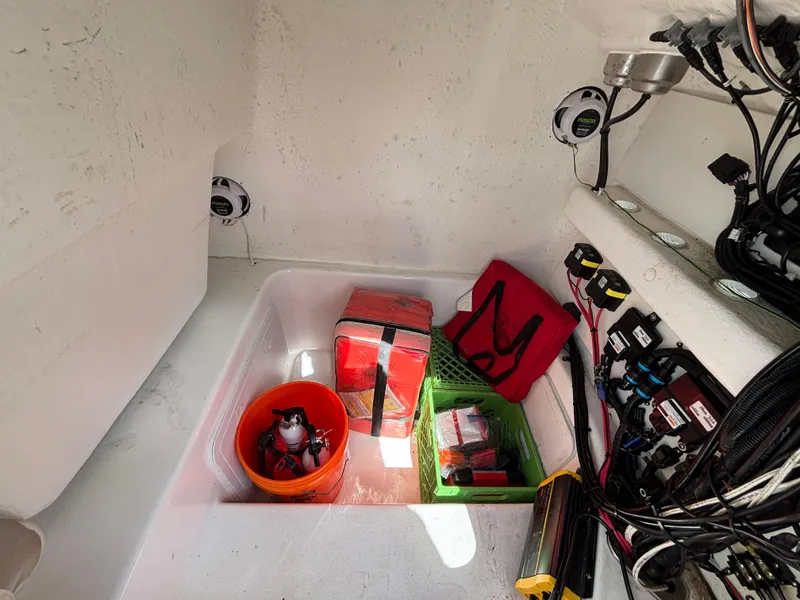 Slide: The Image of 2019 Cape Horn 24 OS boat storage area with equipment and wiring. - 28