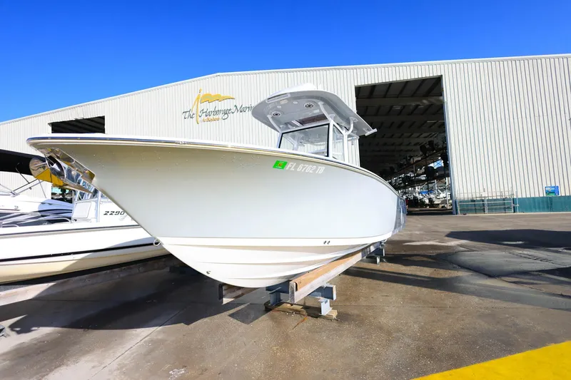 Slide: The Image of 2021 Sportsman Heritage 251 Center Console boat displayed at marina. - 2