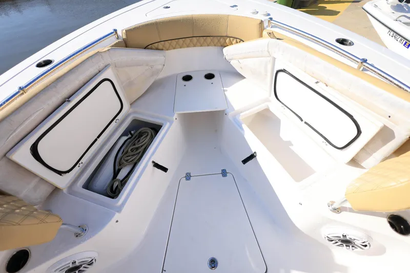 Slide: The Image of 2021 Sportsman Heritage 251 Center Console boat interior with storage compartments. - 24