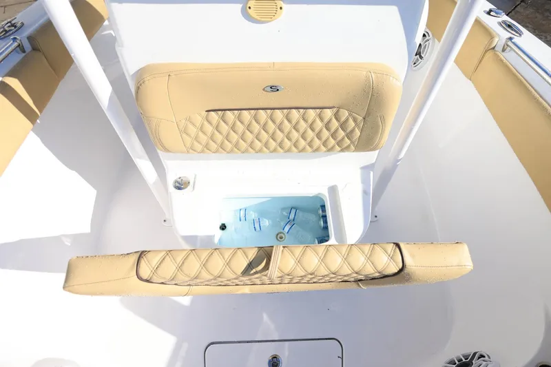Slide: The Image of 2021 Sportsman Heritage 251 Center Console with tan seating and built-in cooler. - 28
